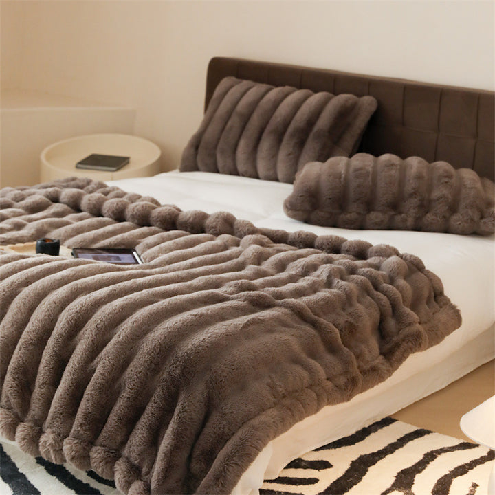 Faux fur blanket with ribbed structure design and velvety soft pile