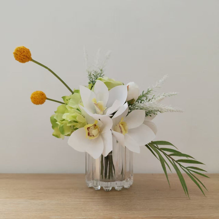 Lifelike Floral Arrangement with Orchids and Greenery