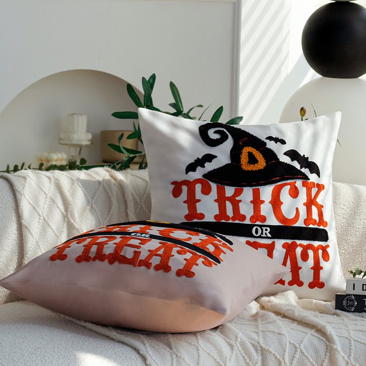 Square decorative cushion cover with witch hat appliqué and 'Trick or Treat' tufting Kalsten
