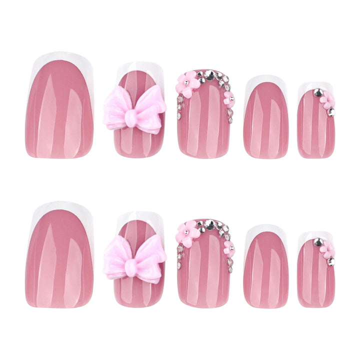 Artful nail extensions with sparkling accents and bow decorations Kalsten