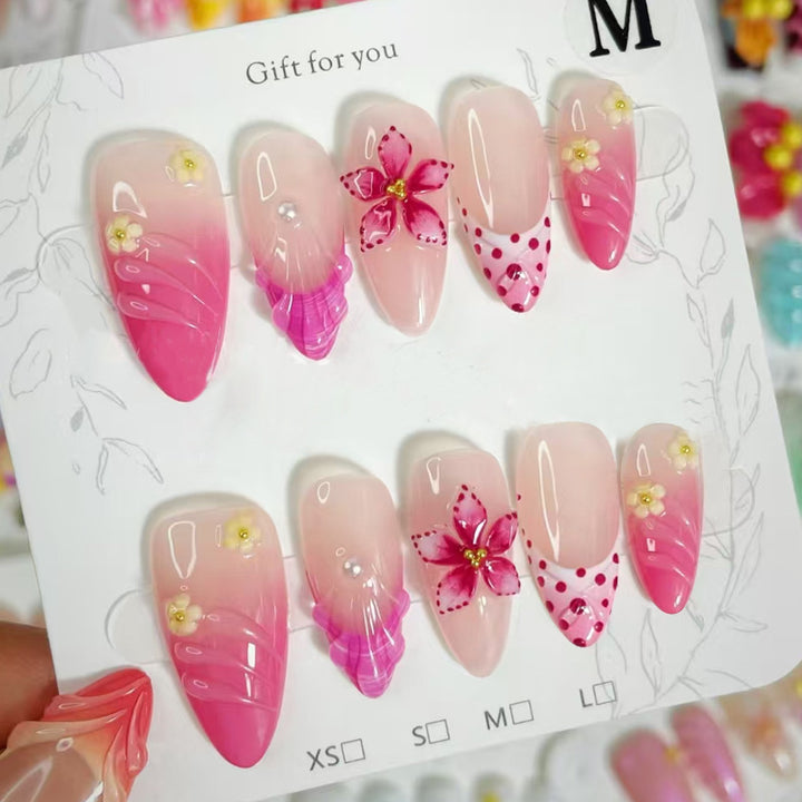 Artful nail tips with delicate floral embellishments Kalsten