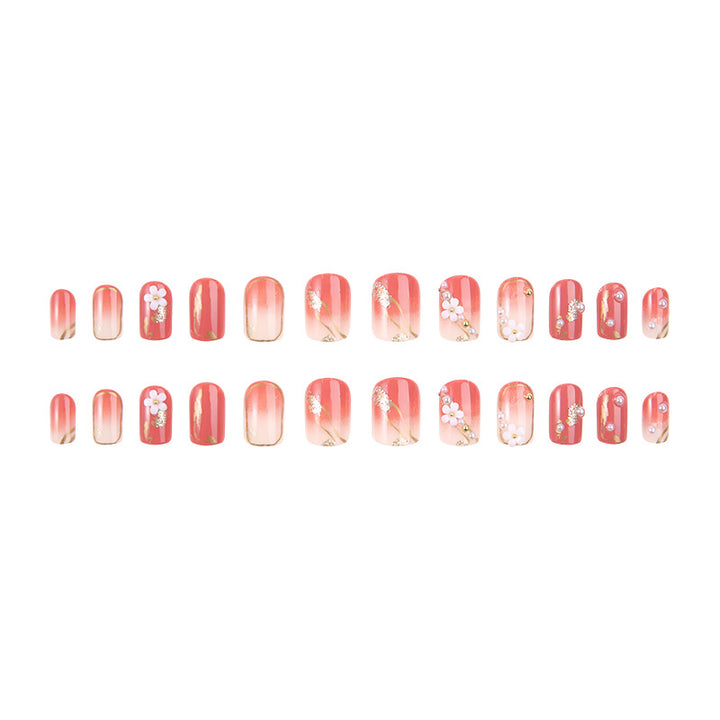 Acrylic nail set with elegant floral decorations and glamorous pearl accents Kalsten