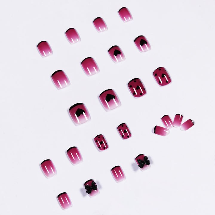 Artistic nail extensions with cute bow and heart designs Kalsten