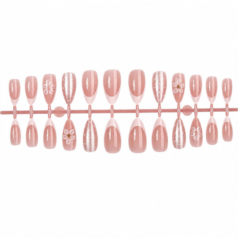 Artificial nail set with elegant French tips and delicate floral accents Kalsten
