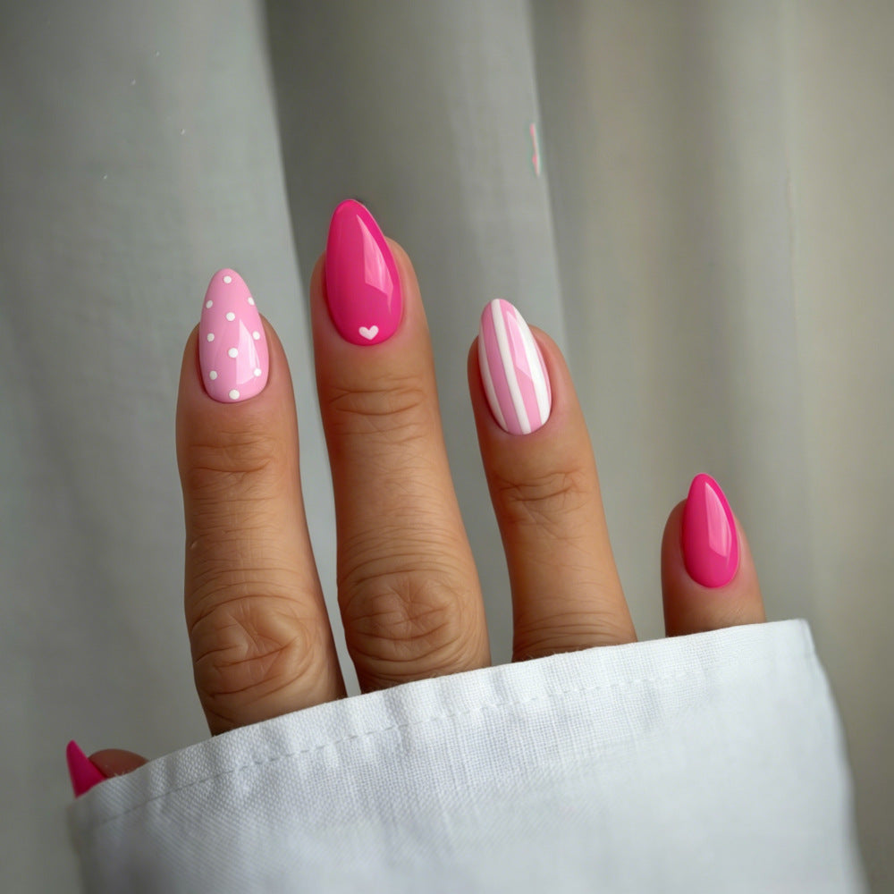 Artificial nails in playful design with hearts and dots Kalsten
