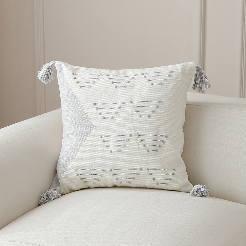 Decorative woven cushion cover with geometric tuft-relief and tassels Kalsten
