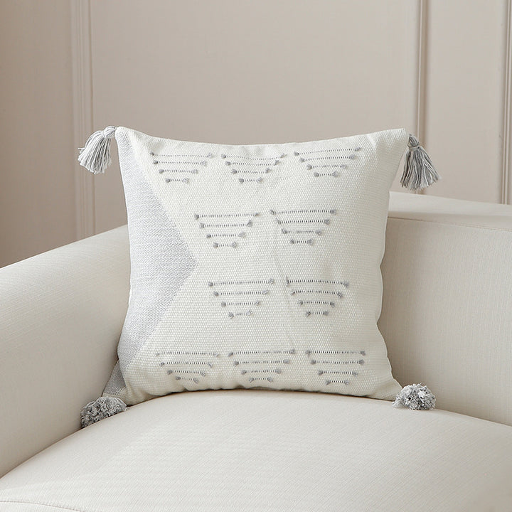 Decorative woven cushion cover with geometric tuft-relief and tassels Kalsten