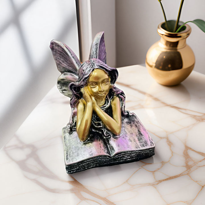 Fairy Figurine Sitting on Books Kalsten