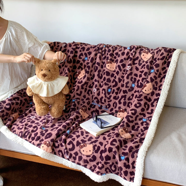 Reversible fleece blanket with cartoon cat design and teddy lining