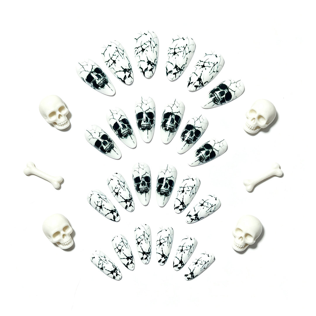 Artificial nails with playful skull design and crackle effects Kalsten