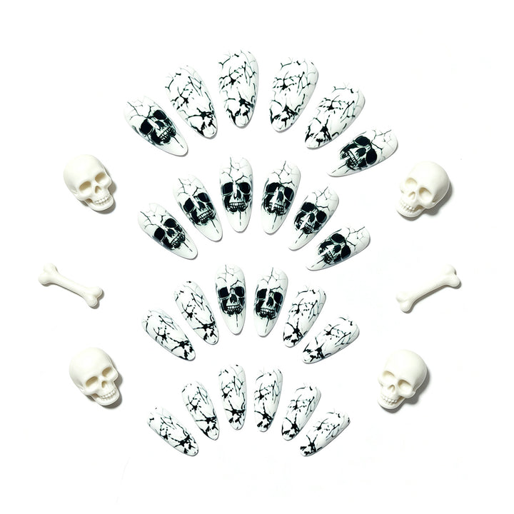 Artificial nails with playful skull design and crackle effects Kalsten