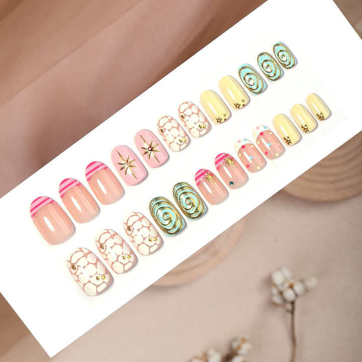 Acrylic nail set with creative abstract designs and glitter accents Kalsten