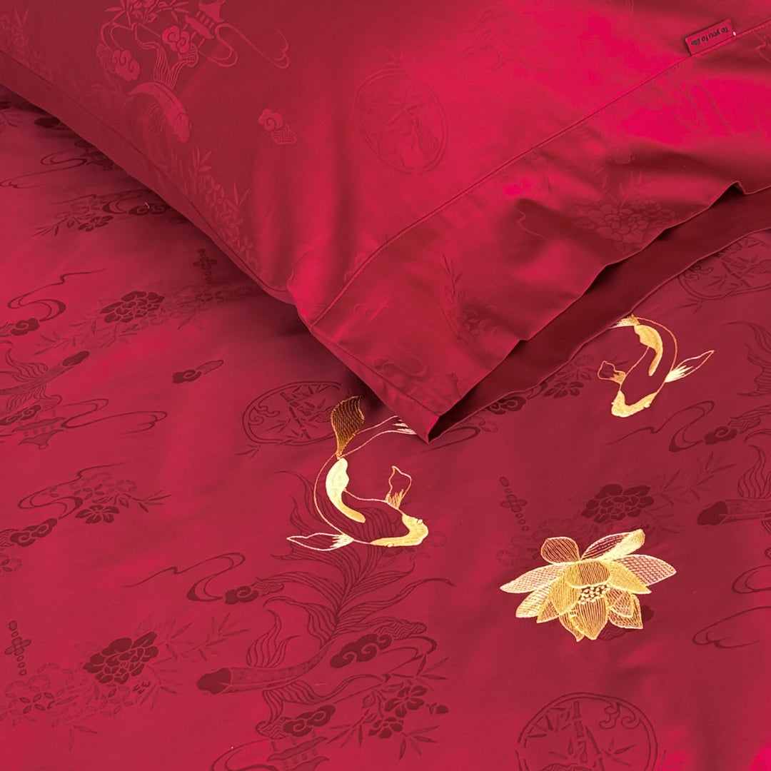 Luxurious bed linen set made of cotton satin with embroidered koi motifs and fine jacquard structure