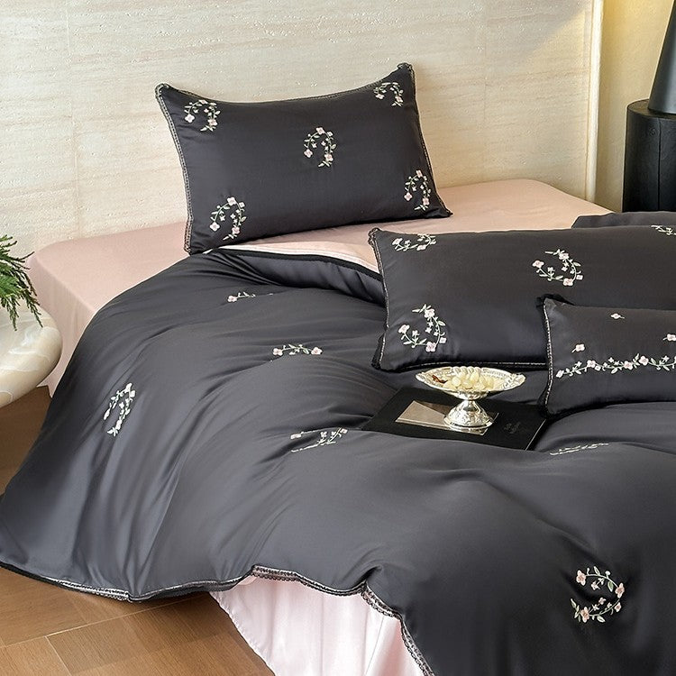 Satin bedding set with pleated frill and delicate embroidery