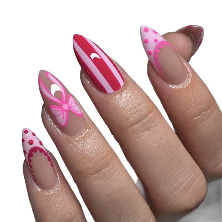 Nail set with playful bow and stripe pattern Kalsten