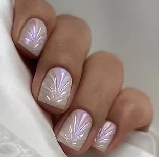 Acrylic nail set with elegant pearl details and fine floral patterns Kalsten