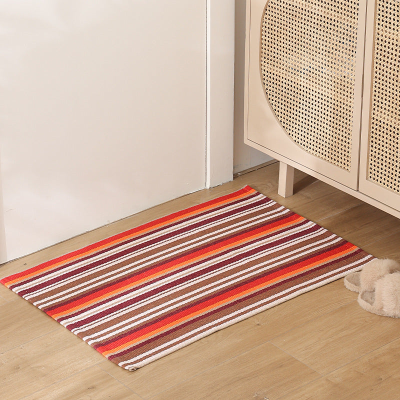 Striped cotton doormat with non-slip bottom and decorative woven edge Kalsten