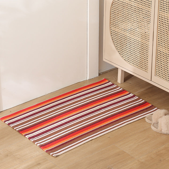 Striped cotton doormat with non-slip bottom and decorative woven edge Kalsten