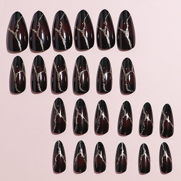 Artistic Press-On Nail Design with Gold Veining Accents Kalsten