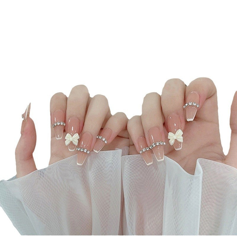 Artificial nails with elegant bow accents and pearl decorations Kalsten