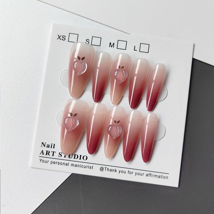 Artificial nails in elegant ombre design with fruit accents Kalsten