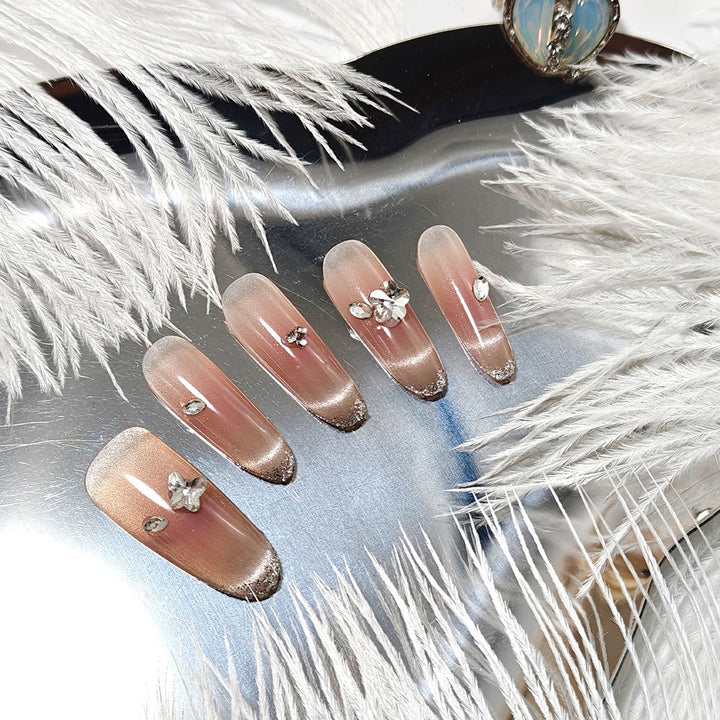 Glamorous artificial nails with glitter decorations Kalsten