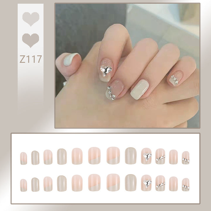 Glamorous artificial nails with heart and rhinestone decorations Kalsten