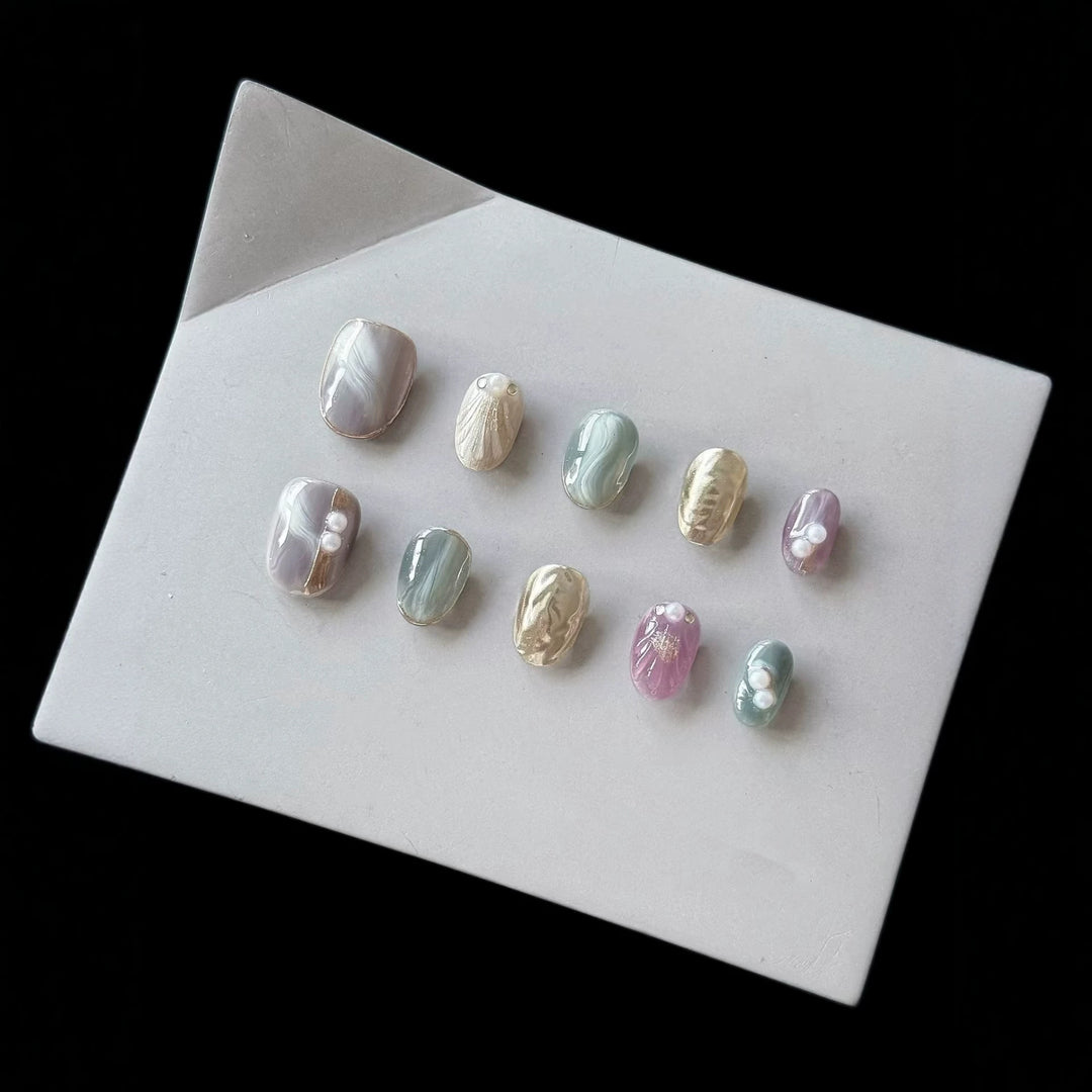 Artistic Press-On Nail Set with Natural Marble Designs