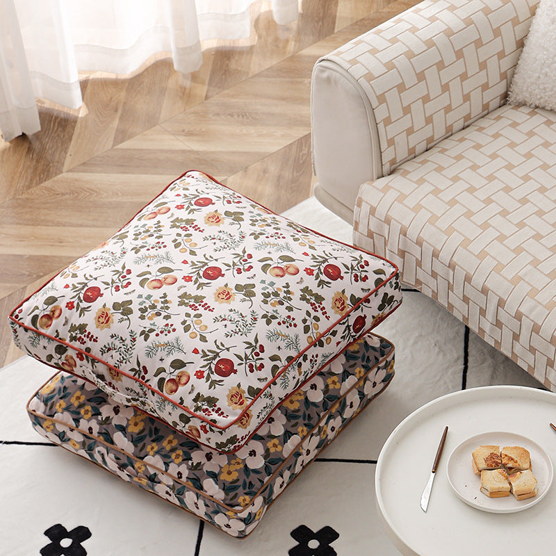 Large square floor cushion with floral cotton cover, piping, and carrying handle Kalsten