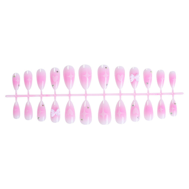 Acrylic nail set with delicate heart-shaped accents Kalsten
