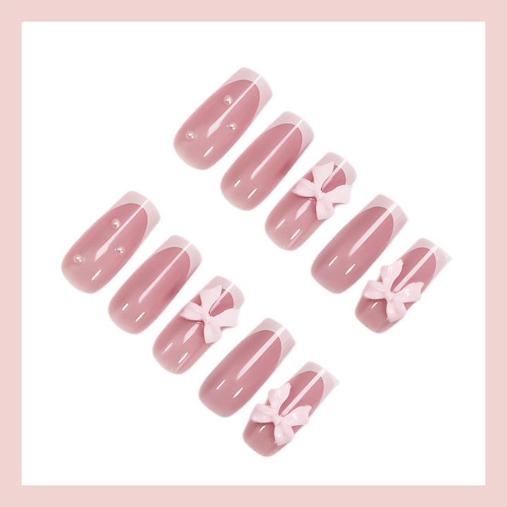 Nail art set with playful ribbon designs and elegant accents Kalsten
