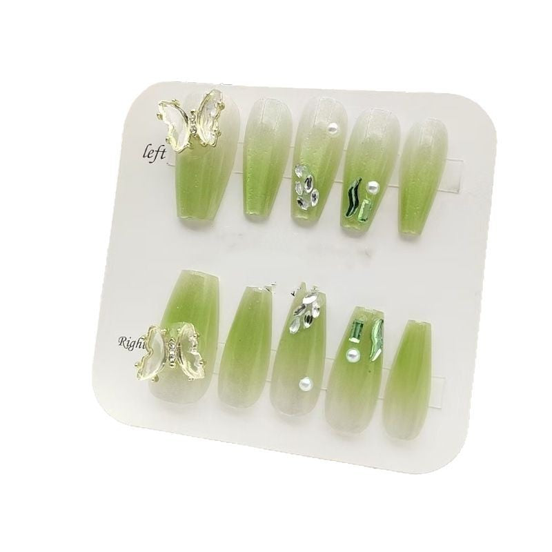 Artificial nails with butterfly accents and glitter details Kalsten