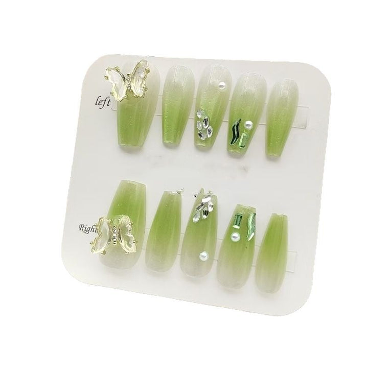 Artificial nails with butterfly accents and glitter details Kalsten