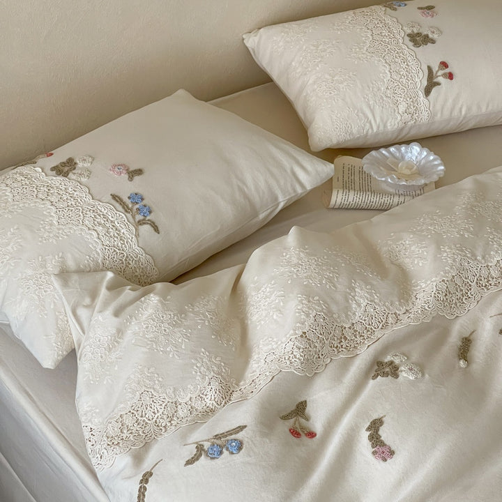 Embroidered cotton satin bedding set with lace trim