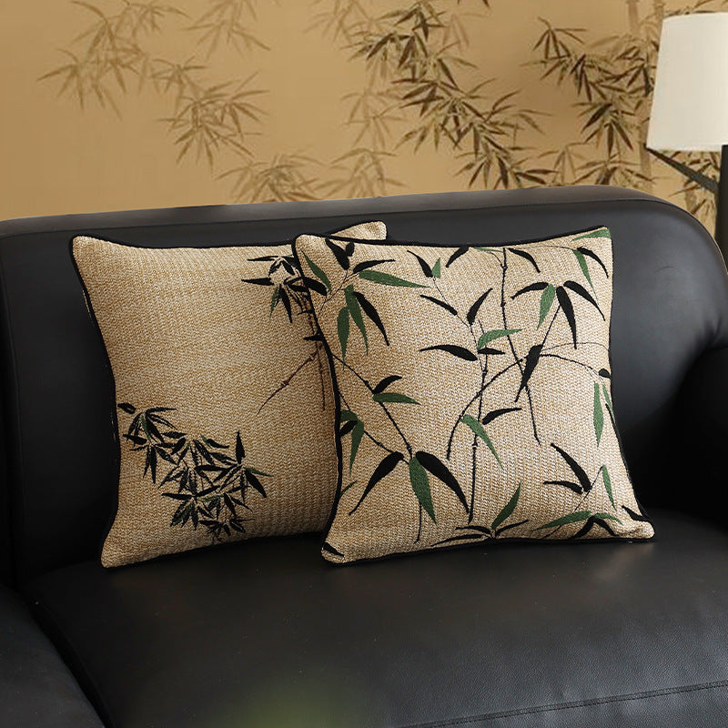 Square decorative pillow with embroidered bamboo design and natural linen texture