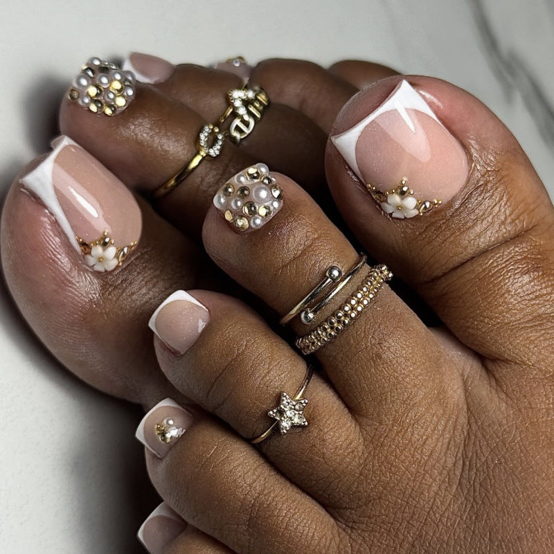 Glamorous toenail art with luxurious rhinestone and floral designs Kalsten