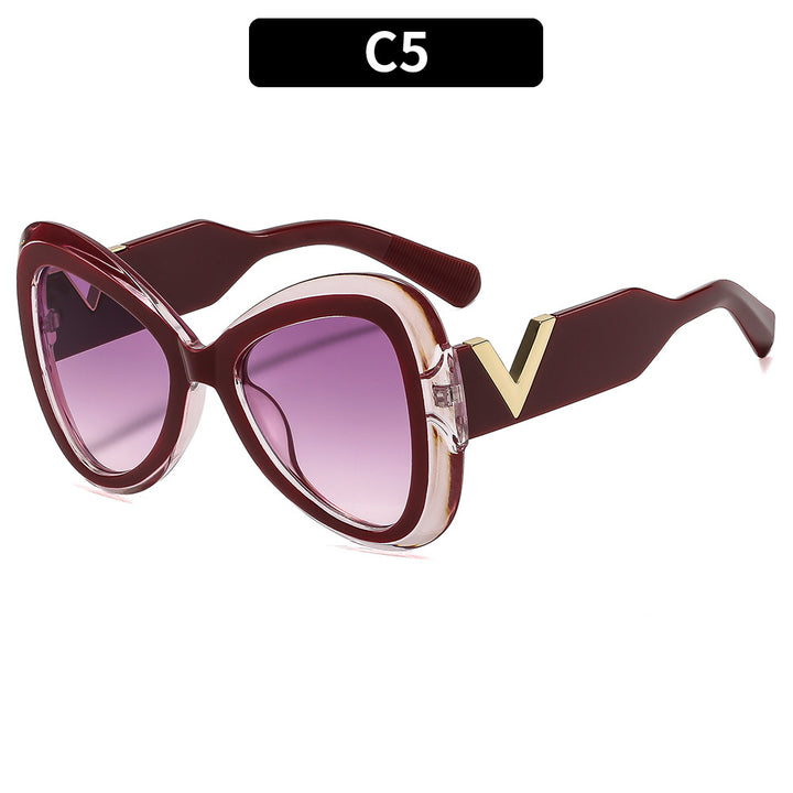 Elegant Cat-Eye Sunglasses with Decorative Temple Design