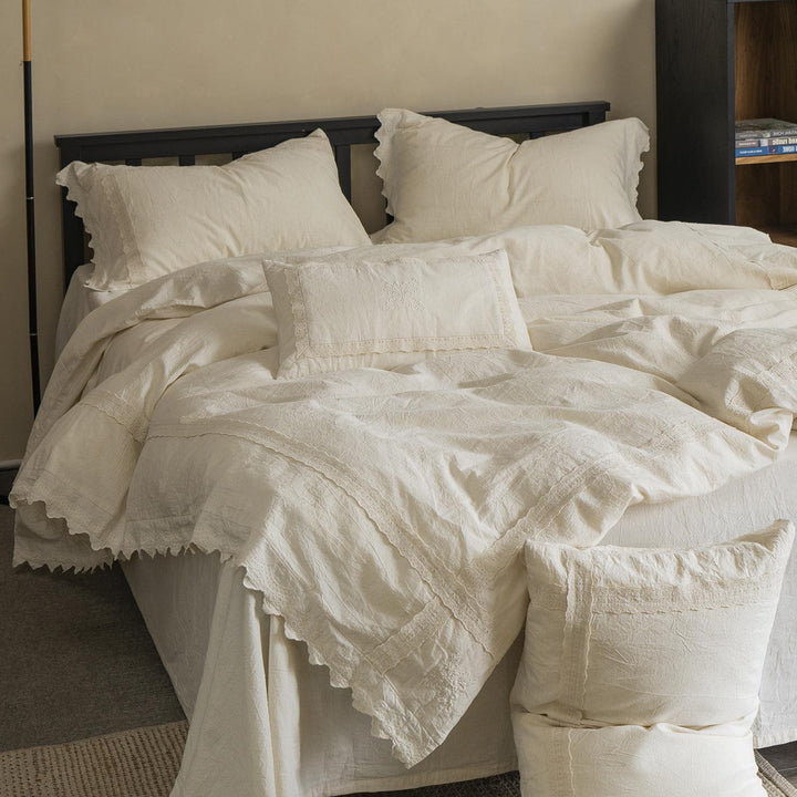Bed linen set in vintage linen style with lace trim and embroidery detail