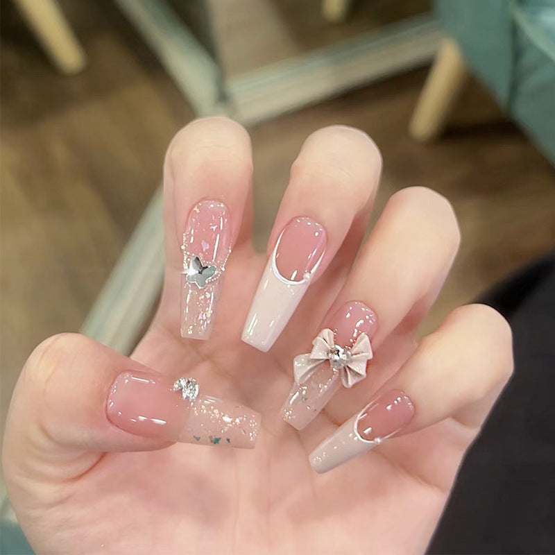 Glamorous artificial nails with delicate flower and glitter effects Kalsten