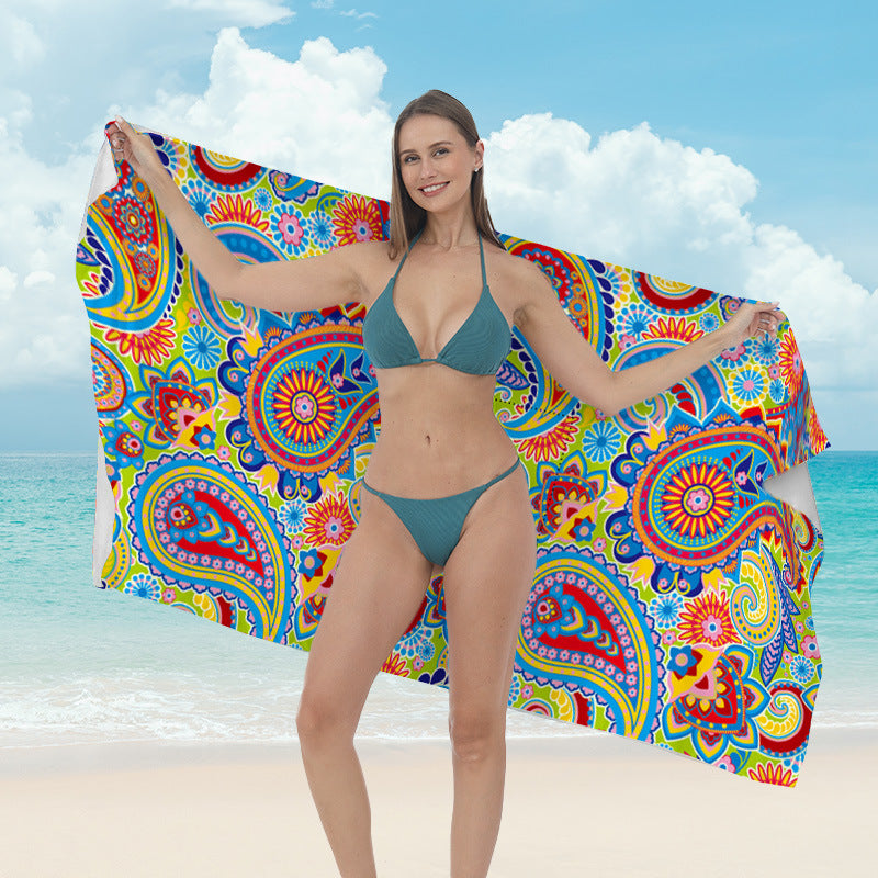 Beach towel with vibrant tropical plant motif Kalsten
