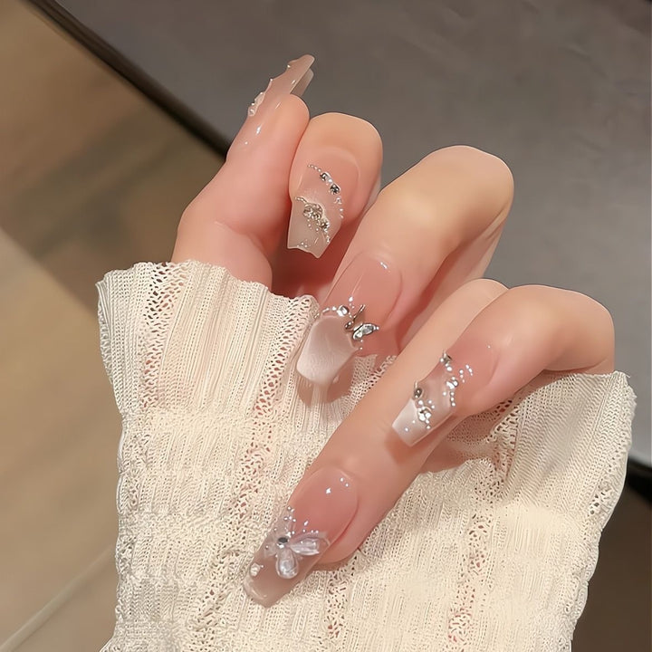 Artificial nails with glamorous decorations and shine Kalsten