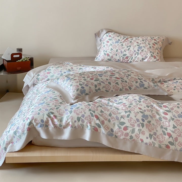 Luxurious satin bedding set with floral watercolor print, ruffled edges and reversible function