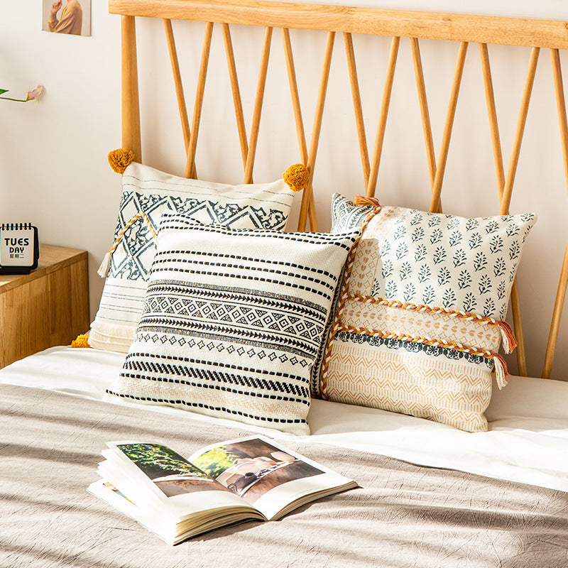 Woven decorative cushion cover in ethnic mix with braided ribbon and tassels Kalsten