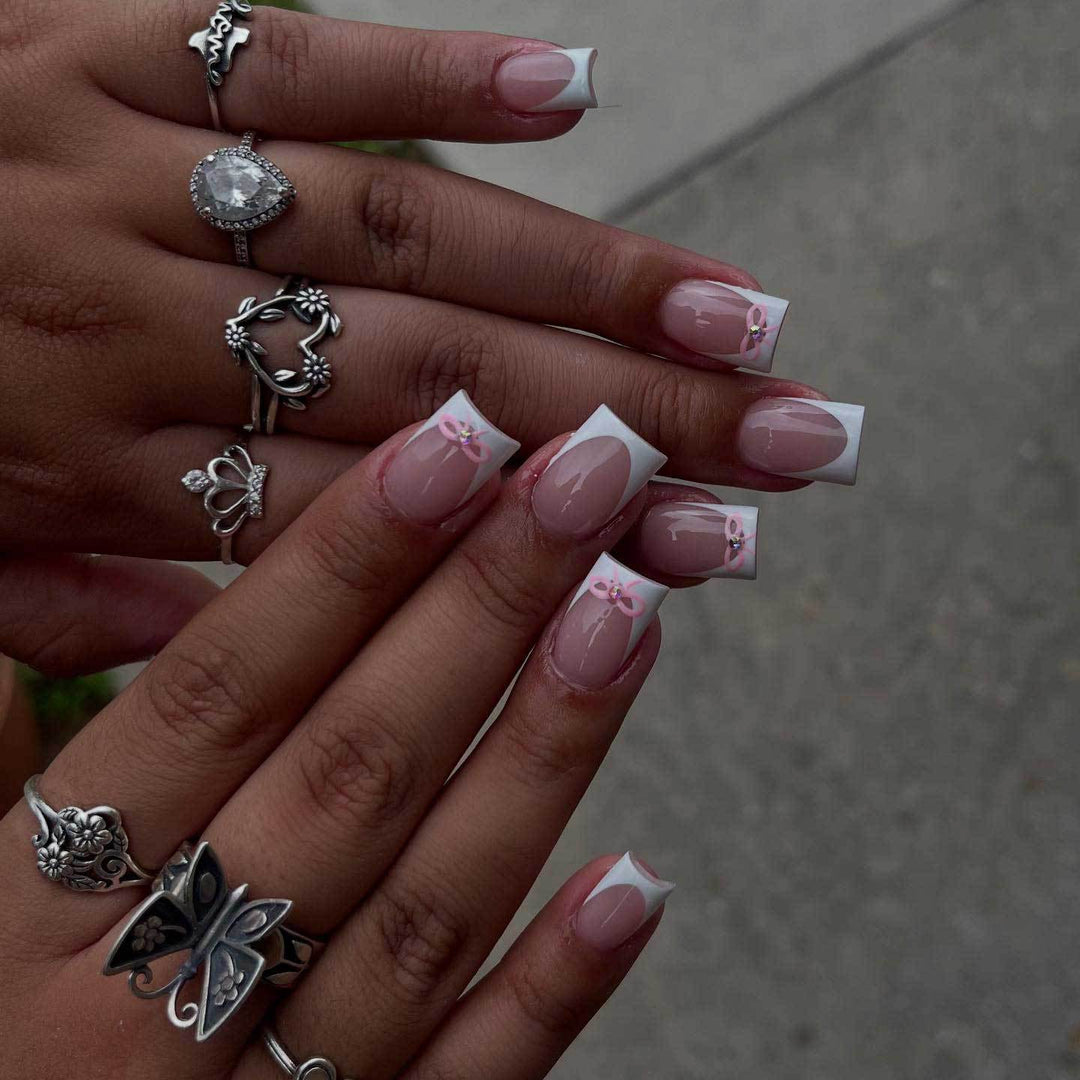 Elegant French Tip Nail Art Set with Delicate Bow Accents