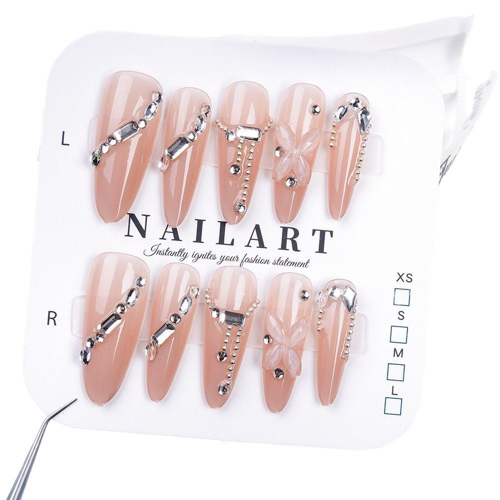 Artistic Press-On Nail Design with Floral and Glitter Accents Kalsten