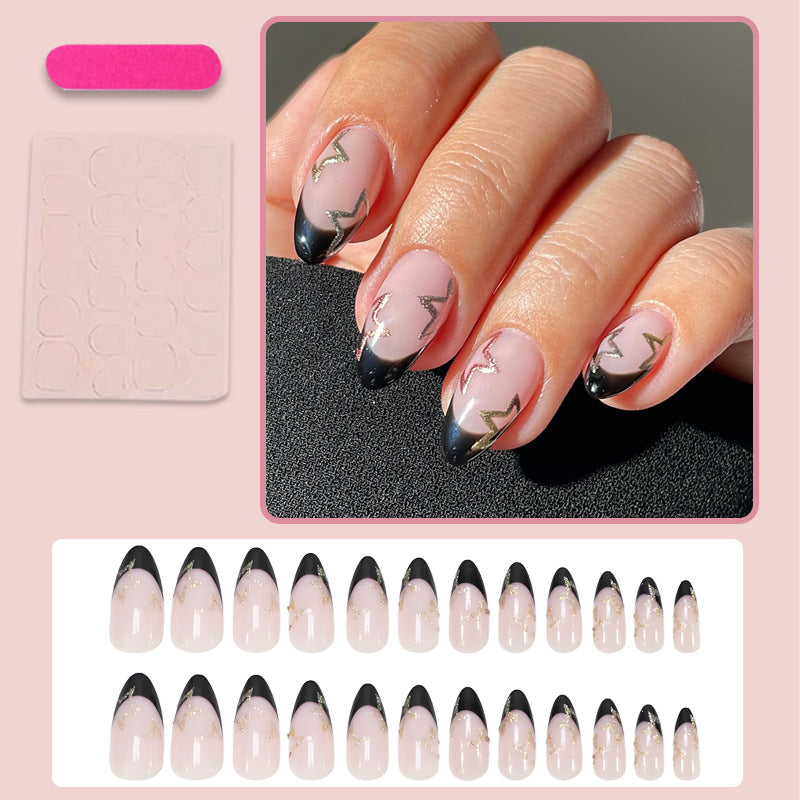 Acrylic nail set with elegant French tip design and glamorous accents Kalsten