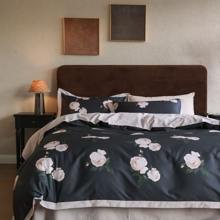 Cotton satin bedding set with subtle botanical print and contrasting hem edge