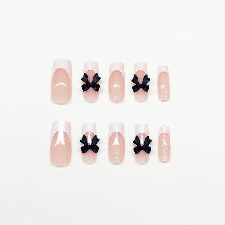 Acrylic nail set with stylish black and pearl details Kalsten