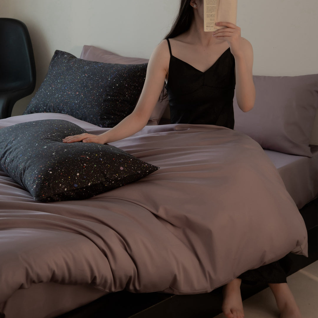 Luxurious cotton satin bedding set with contrasting patterned pillows