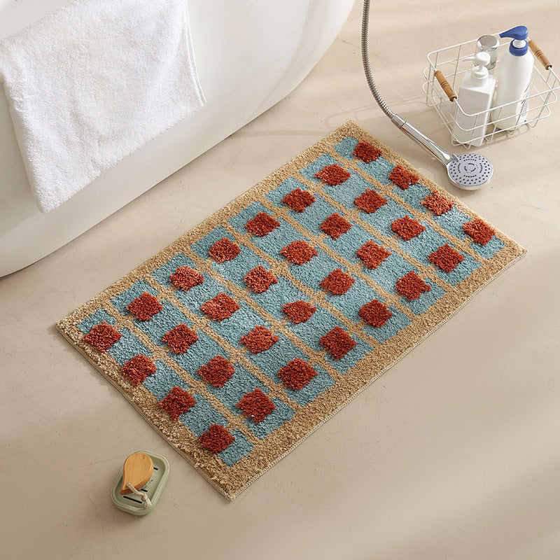 Hand-tufted bathroom bath mat with non-slip backing and textured square relief Kalsten
